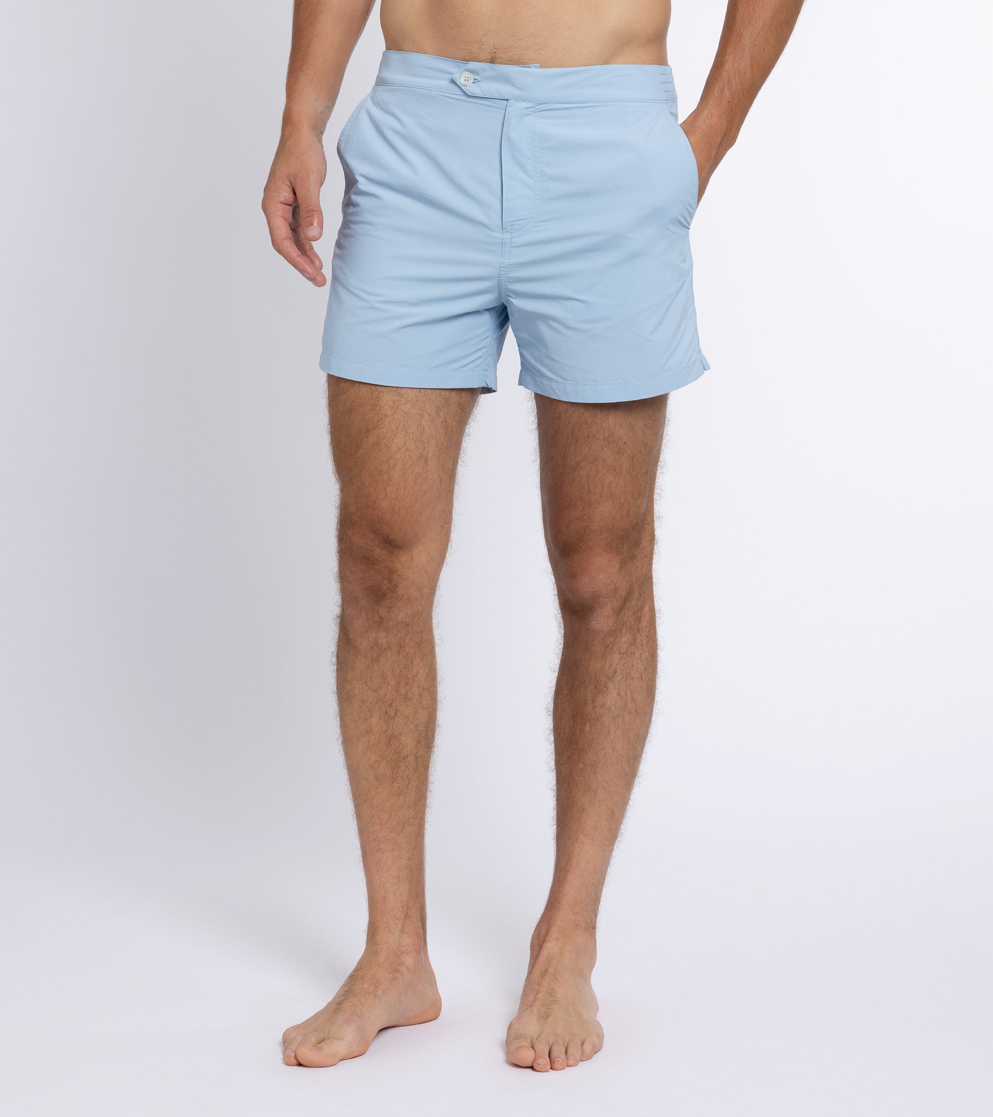 Trunk Foley swim shorts in light blue, styled shot.