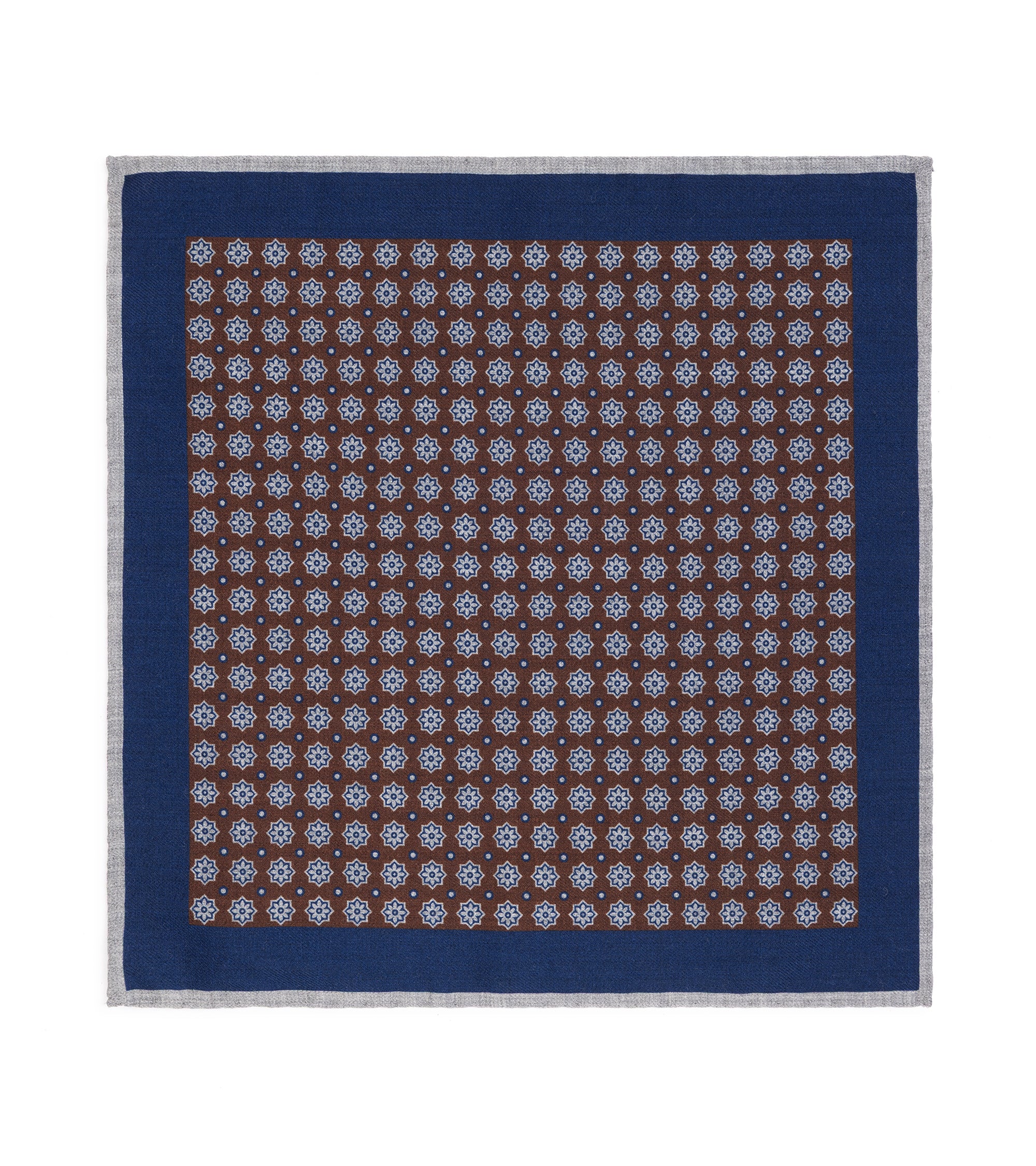 A pocket square with a dark brown center patterned with small white floral motifs, surrounded by a wide navy border and a thin gray edge.