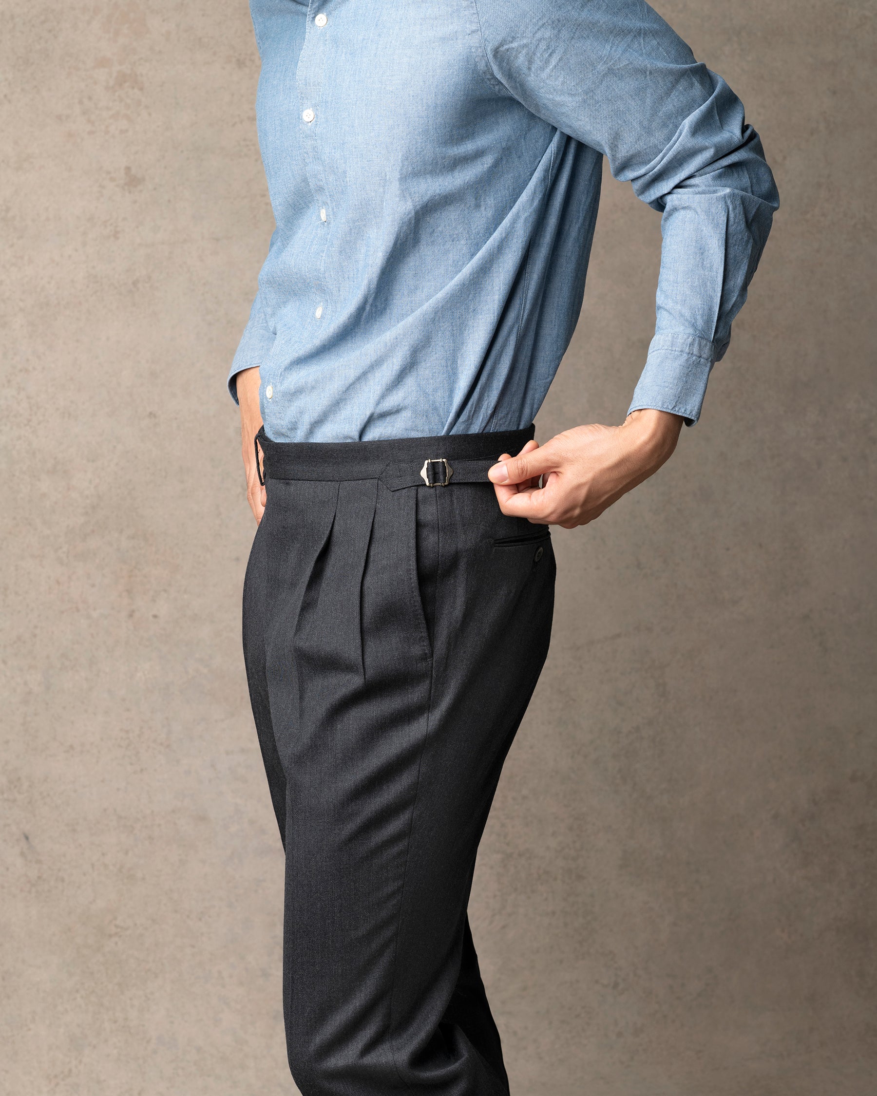 Echizenya for Trunk wool serge pleated trousers in charcoal, styled shot.