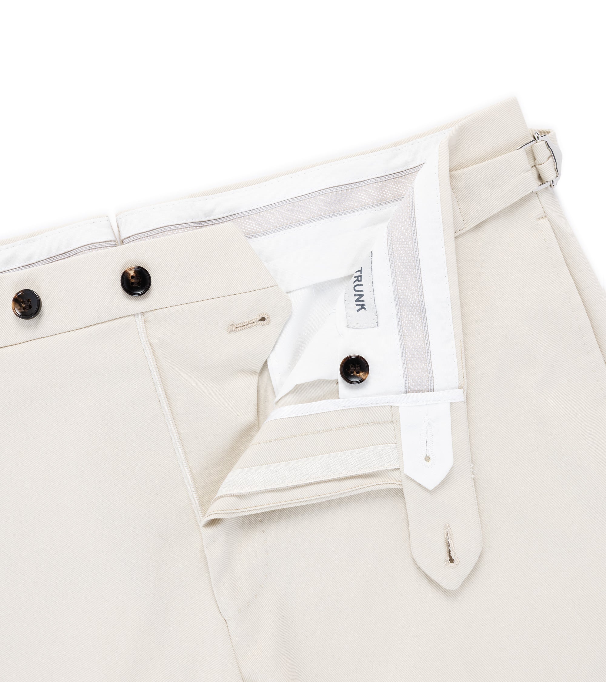 Trunk Walbrook cotton tailored trousers in light beige, close-up of the waistband and pocket.