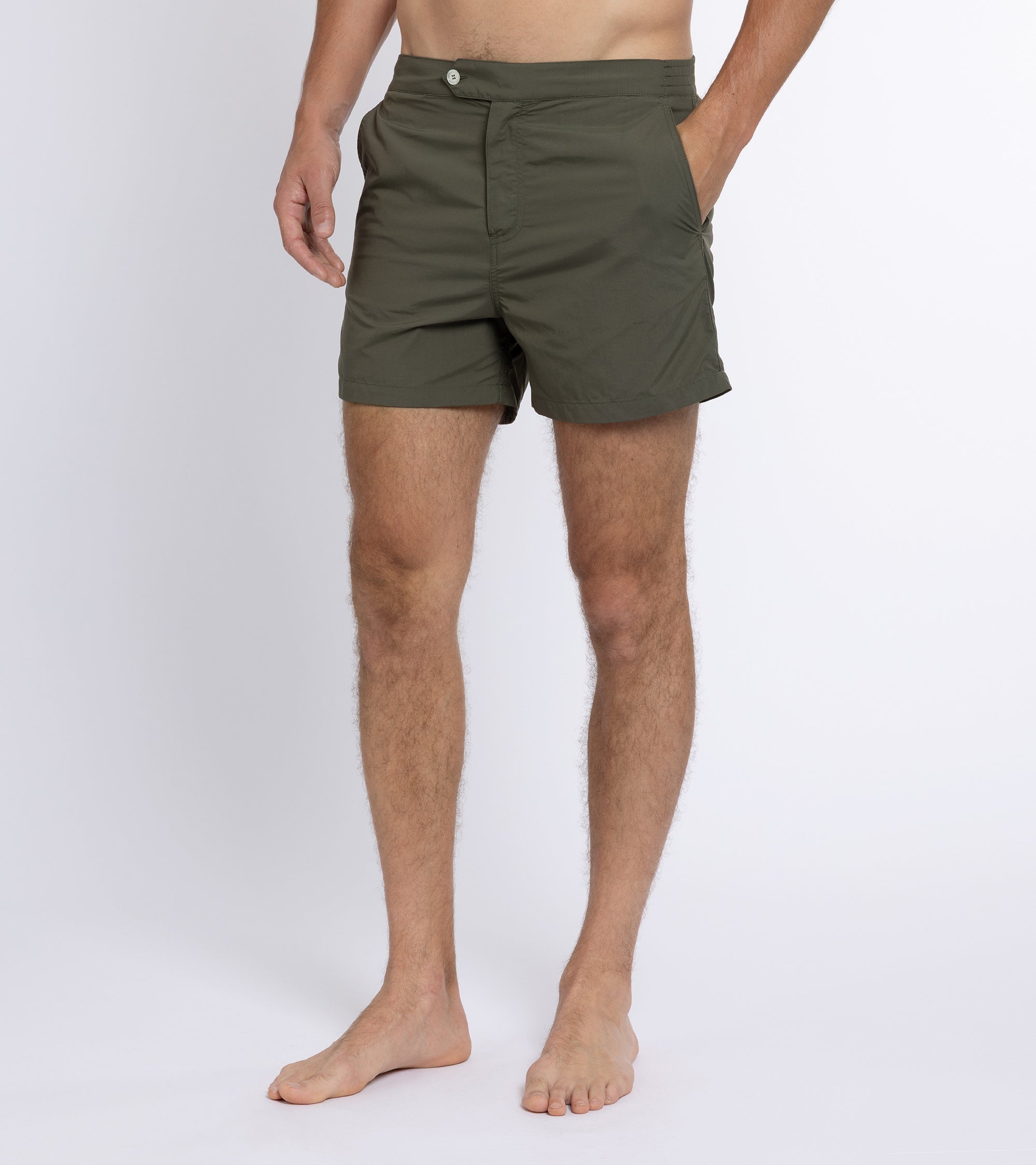 Trunk Foley swim shorts in olive, styled shot.