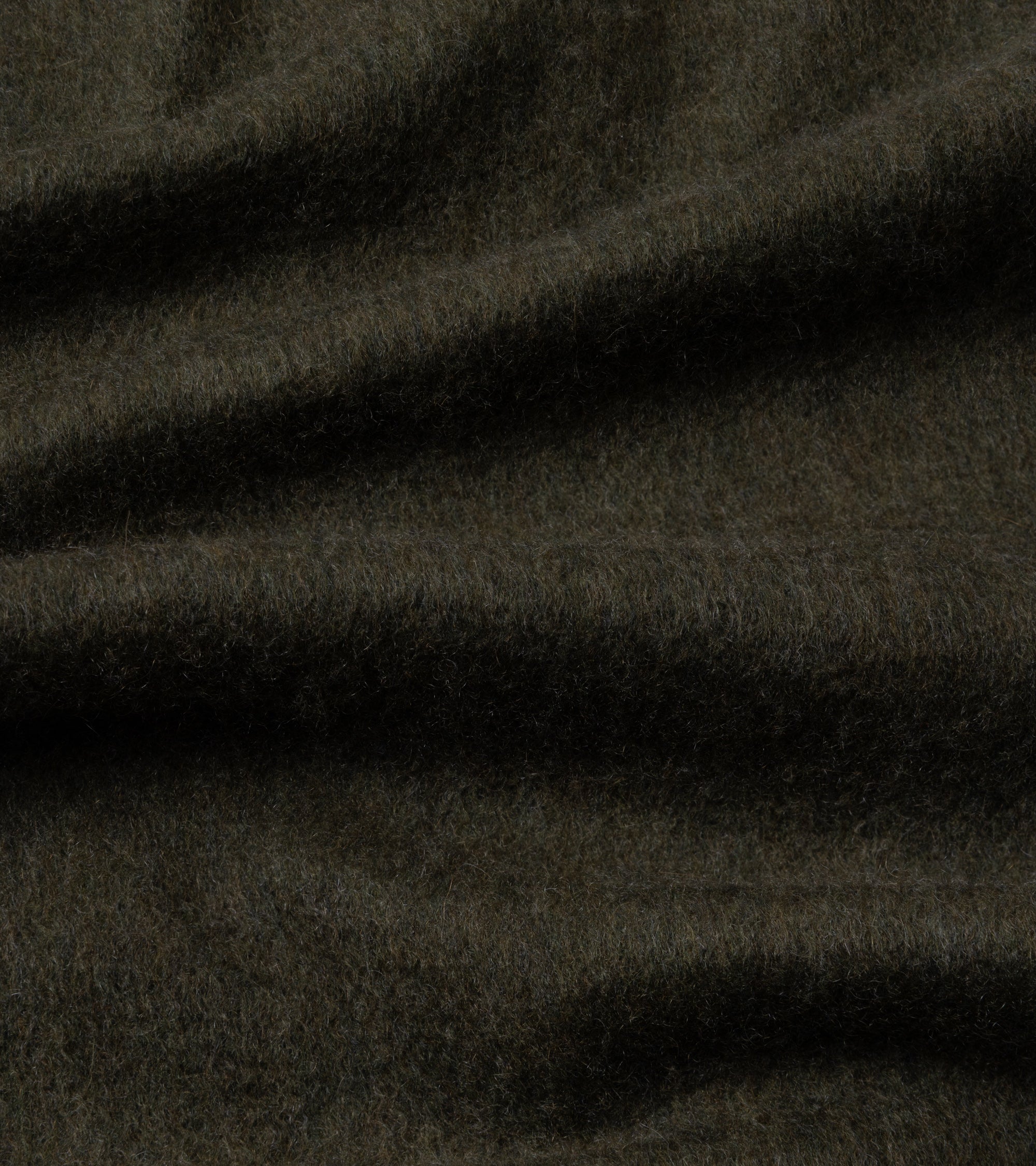 A close-up of dark olive textured fabric with soft folds and a fuzzy, brushed surface.