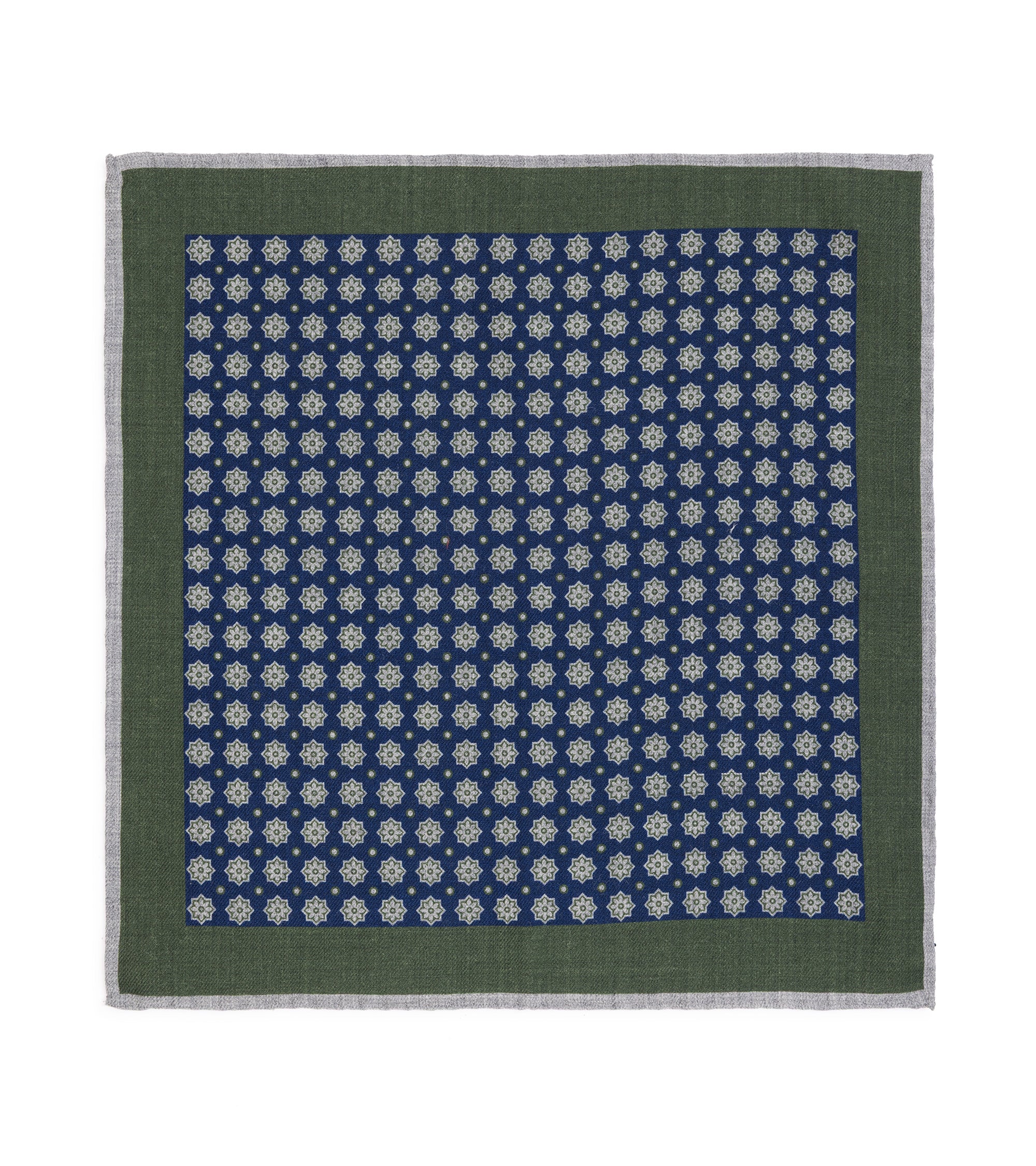 A pocket square with a dark green border and a navy blue center patterned with repeating white floral motifs, shown flat against a white background.