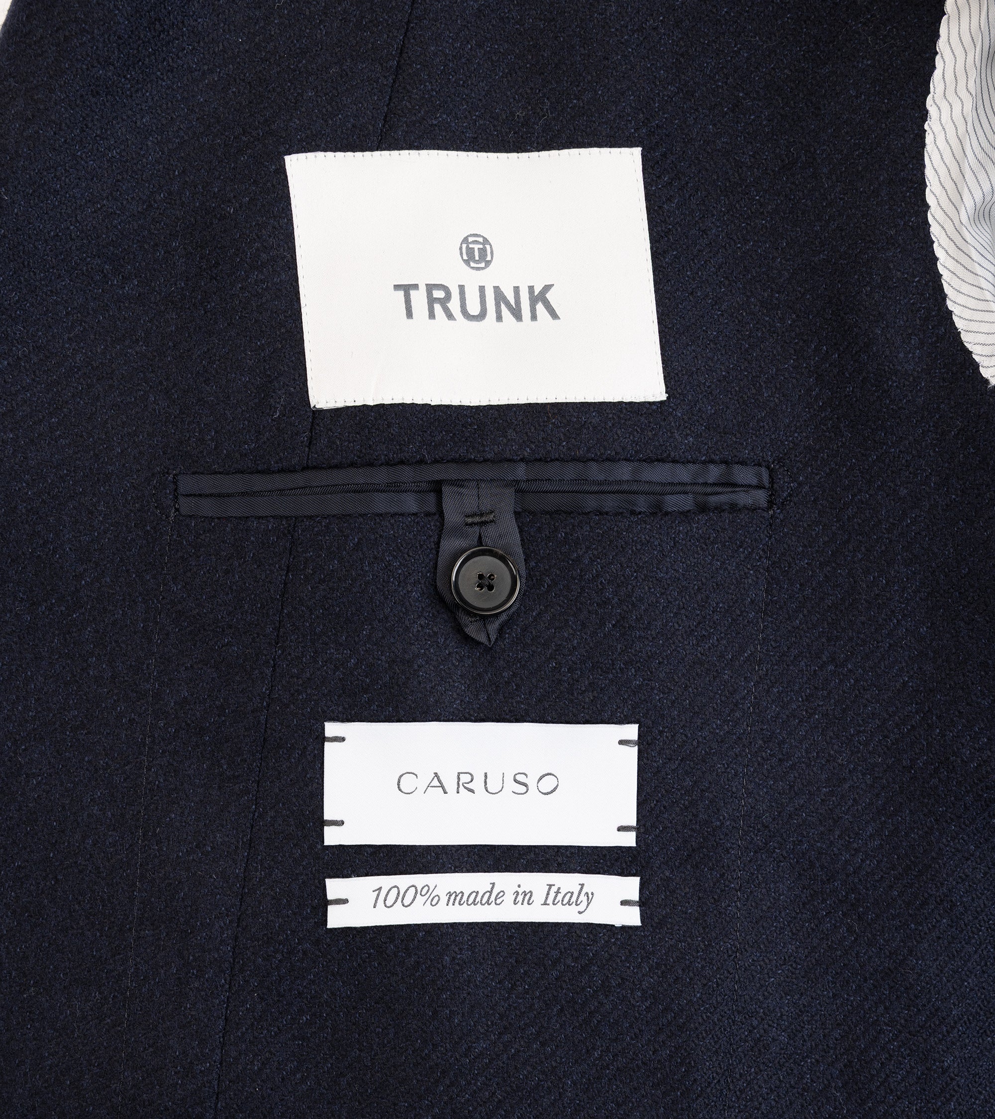 Caruso Aida double breasted jacket in navy wool cashmere twill. Lining detail showing fabric texture and labels.