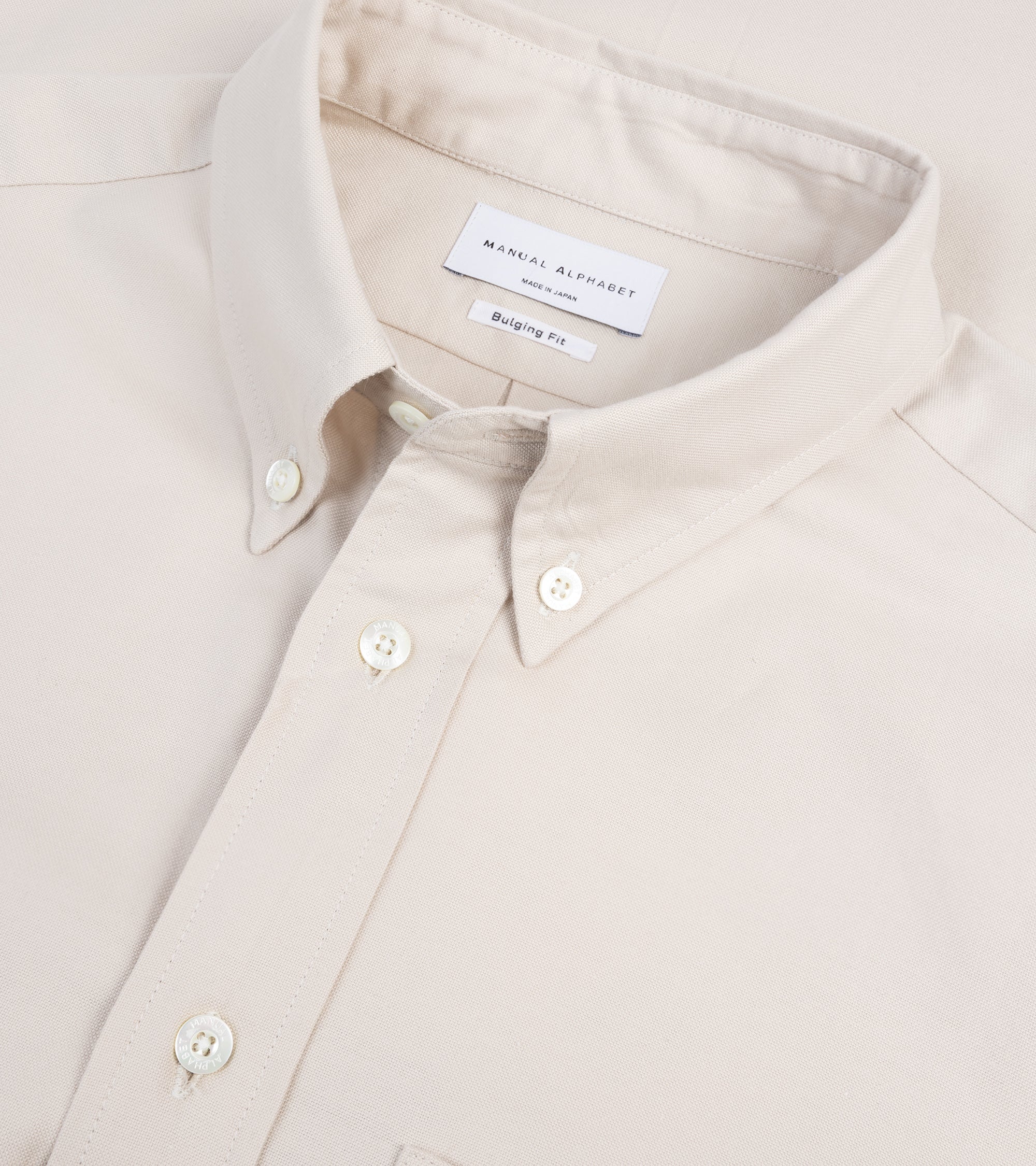 Manual Alphabet button-down shirt in ivory Supima cotton Oxford, fabric detail of the Oxford weave.