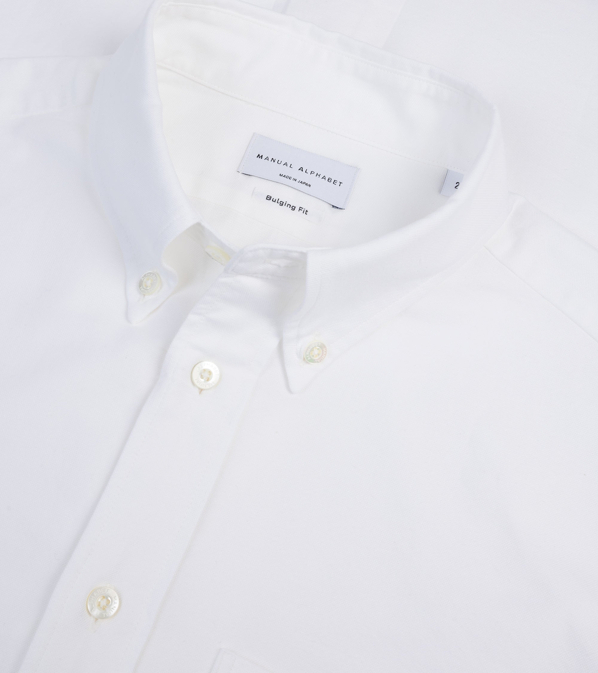 Manual Alphabet button-down shirt in white Supima cotton Oxford, fabric detail of the Oxford weave.