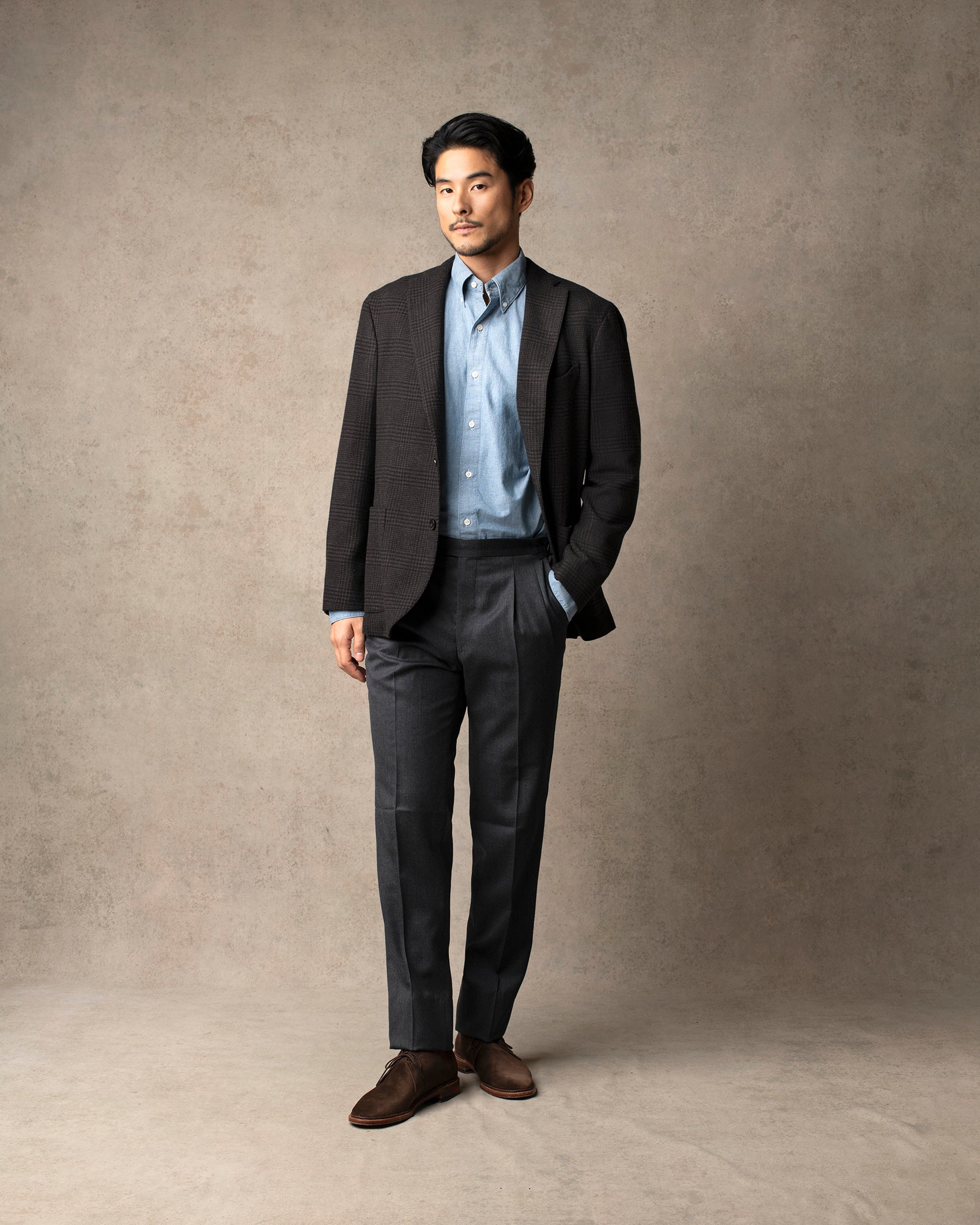 Echizenya for Trunk wool serge pleated trousers in charcoal, styled shot.
