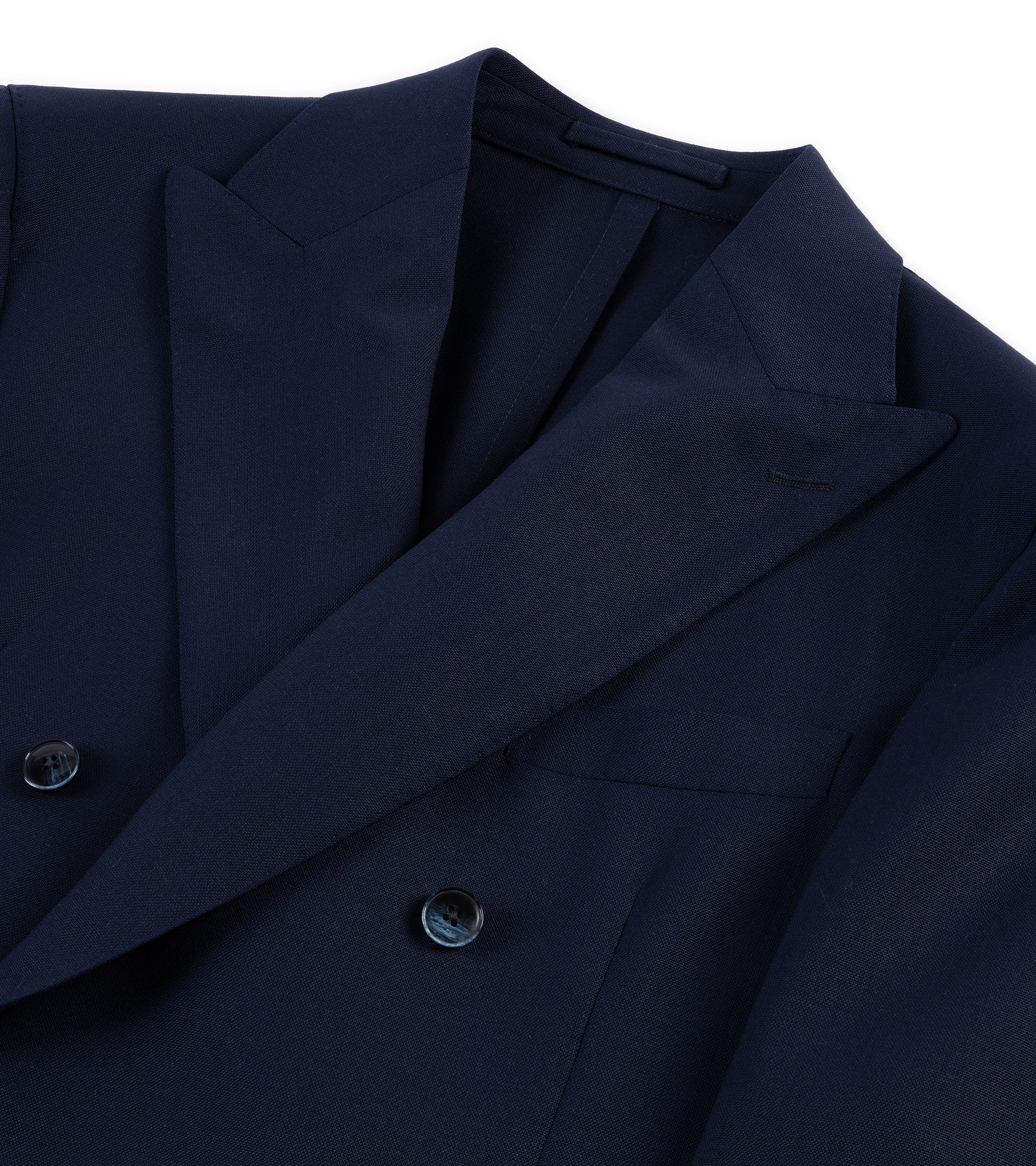Trunk Webb double breasted jacket in navy tropical wool, close-up of the lapel and buttons.