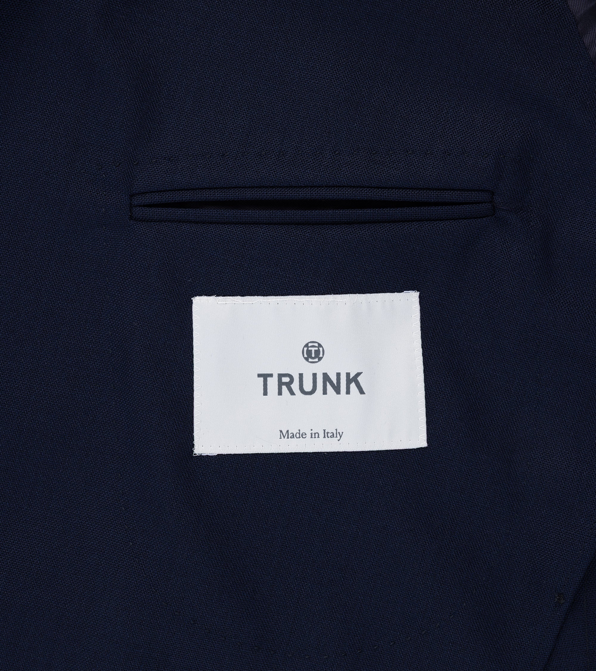 Trunk Webb double breasted jacket in navy tropical wool, styled shot.